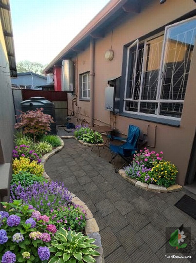 After: the yard remixed into Lush Garden Beds by YardRemix AI
