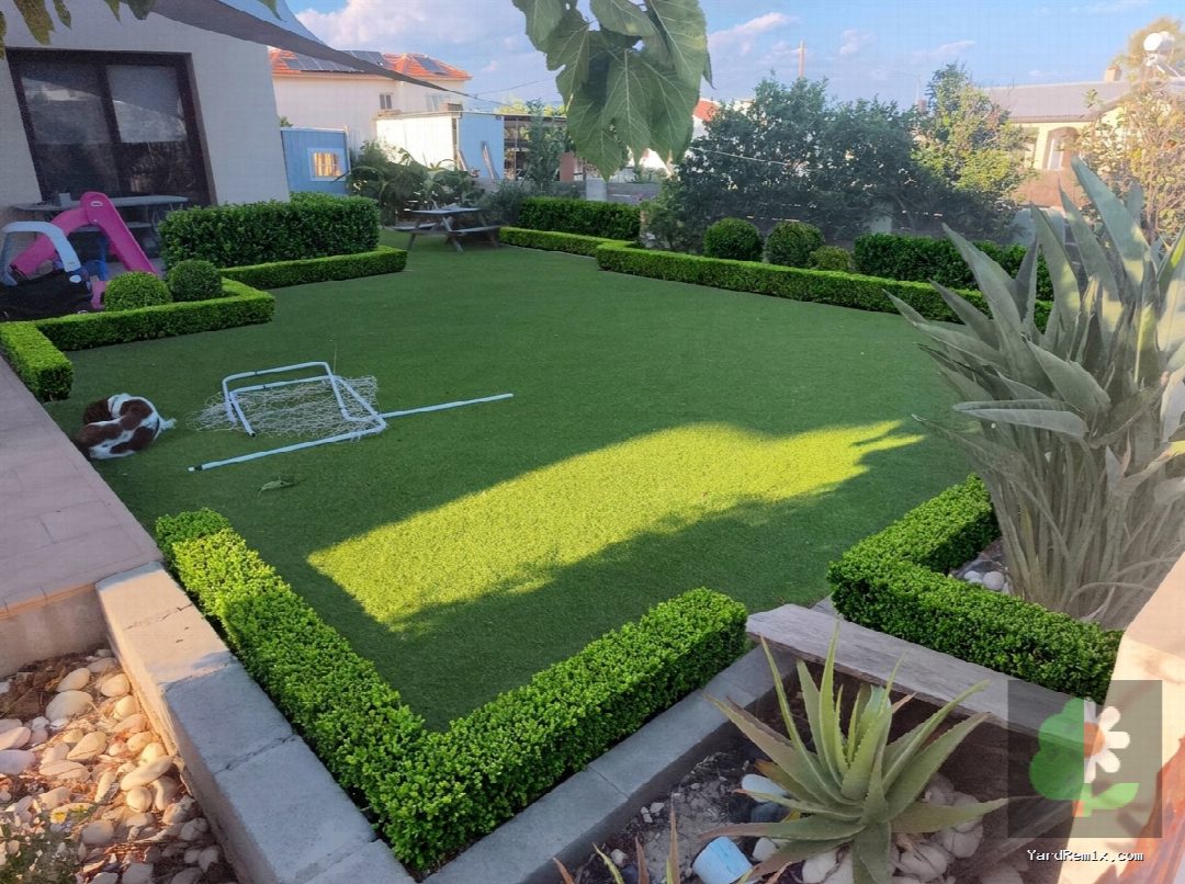 After: the yard remixed into Boxwood Hedges by YardRemix AI