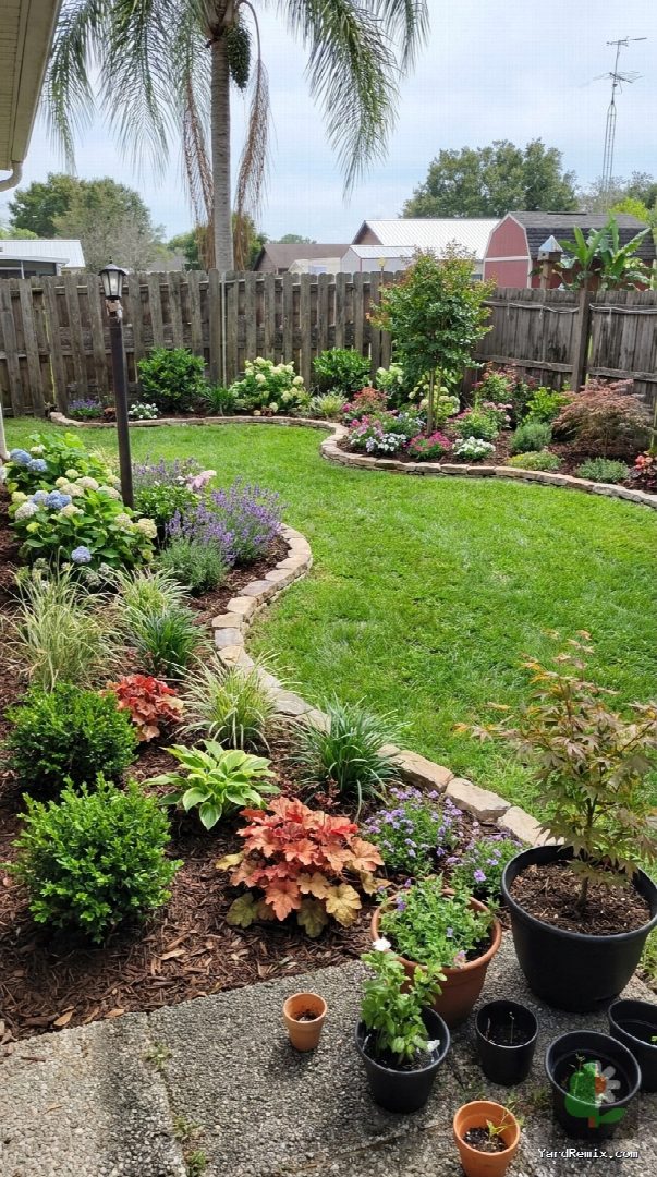 After: the yard remixed into Lush Garden Beds by YardRemix AI